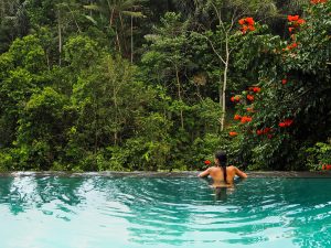 the-girl-swimming-outside-jungle-pool-bali-ubud